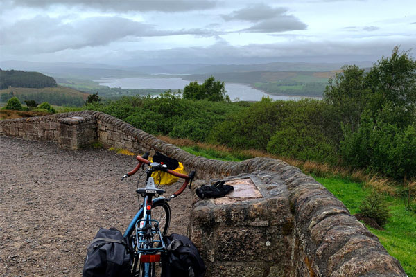 Photo of a touring bicycle overlooking a loch at Kyle of Sutherland