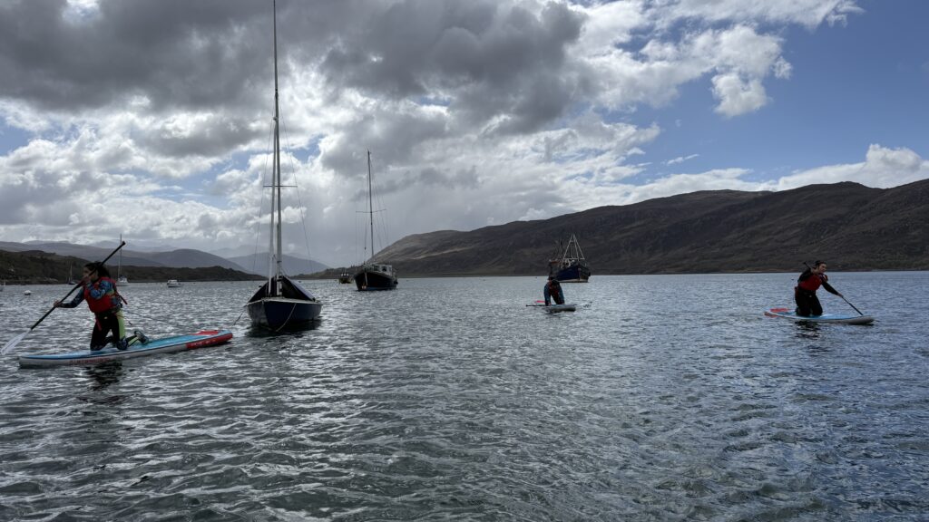 several paddleboarders on the sea 